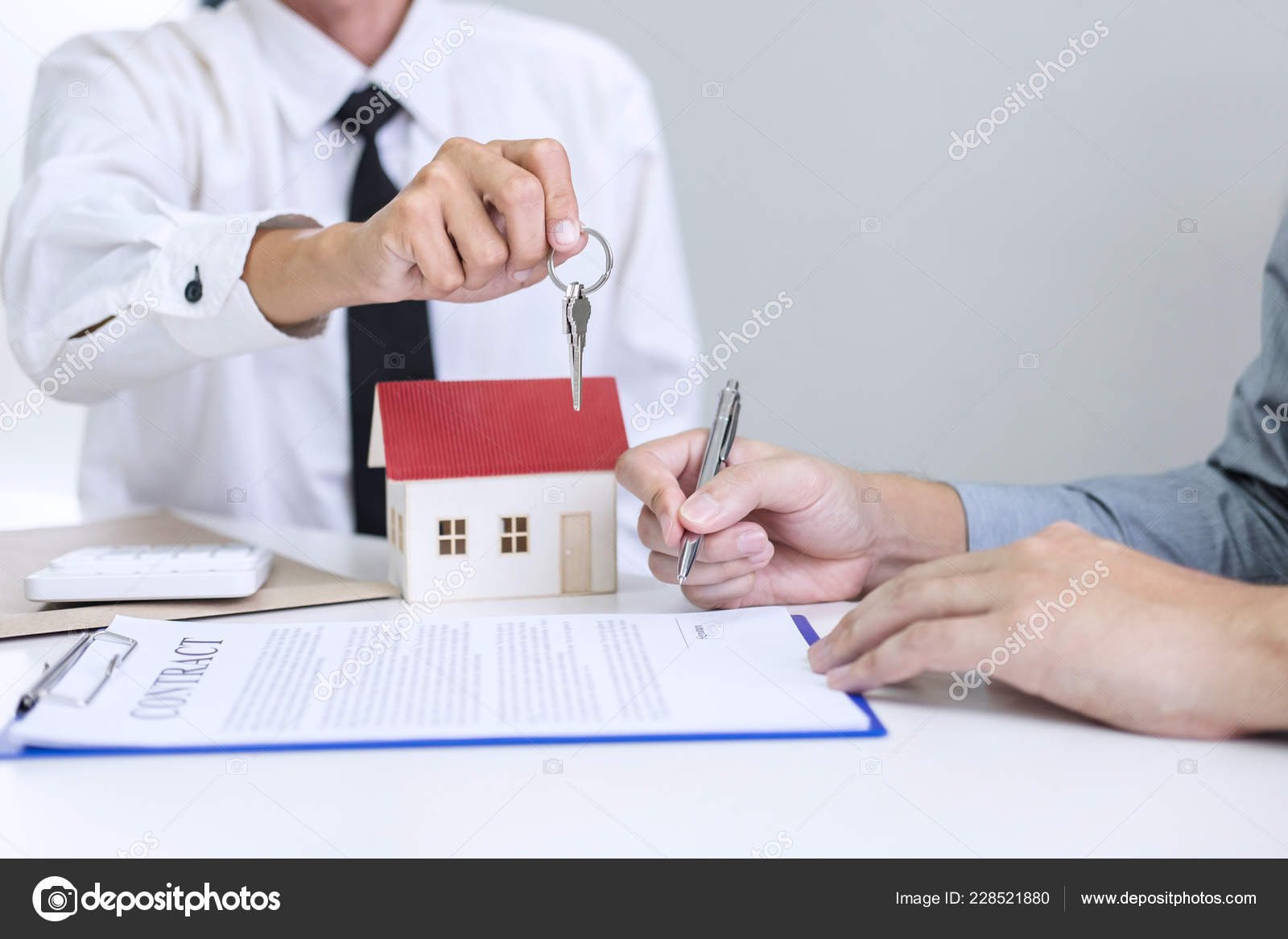 Real Estate Sales Manager Giving Keys Customer Signing Rental