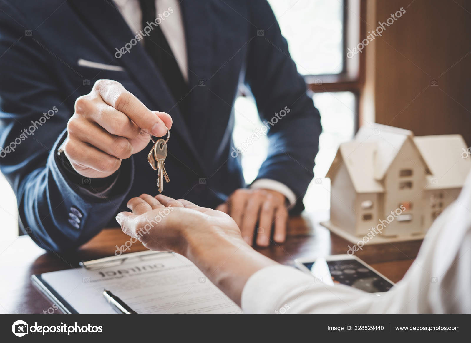 Real Estate Agent Sales Manager Holding Filing Keys Customer