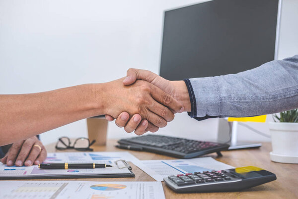 Finishing up a meeting, Business handshake after discussing good deal of Trading contract for both companies and gesturing people connection deal, Meeting and greeting concept.