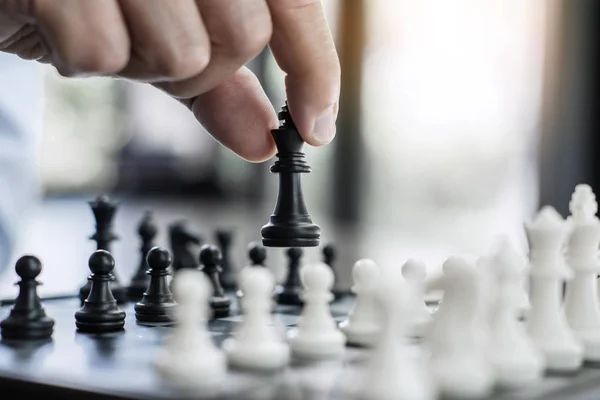 Businessman`s Hand Playing Chess Game To Development Analysis Ne Stock  Photo - Image of competition, business: 123928716