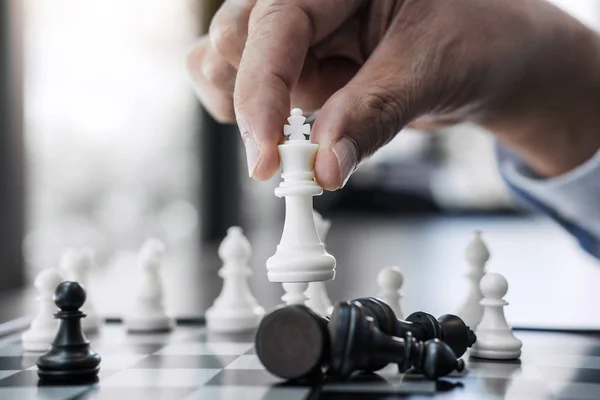 Businessman`s Hand Playing Chess Game To Development Analysis Ne Stock  Photo - Image of competition, business: 123928716