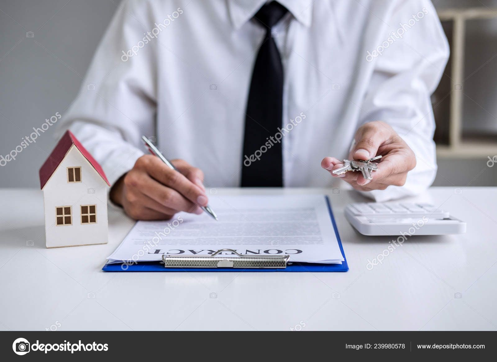 Real Estate Agent Sales Manager Holding Filing Keys Customer