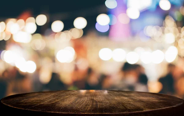 Selective Empty wooden table in front of abstract blurred festiv — Stock Photo, Image