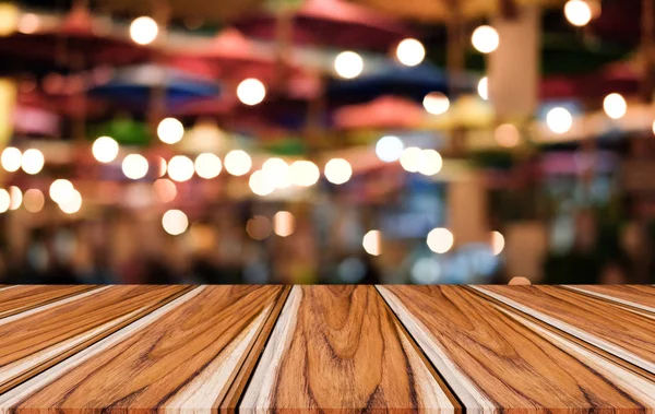 Selective Empty wooden table in front of abstract blurred festiv — Stock Photo, Image