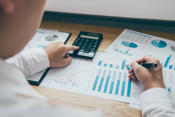 Businessman working on a graph document financial report and ana — Stock Photo, Image