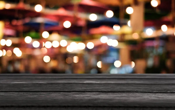 Selective Empty wooden table in front of abstract blurred festiv — Stock Photo, Image