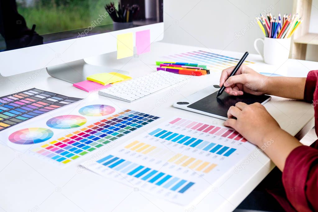 Image of female creative graphic designer working on color selec
