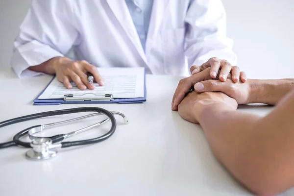 Doctor touching patient hand for encouragement and empathy in th — Stock Photo, Image