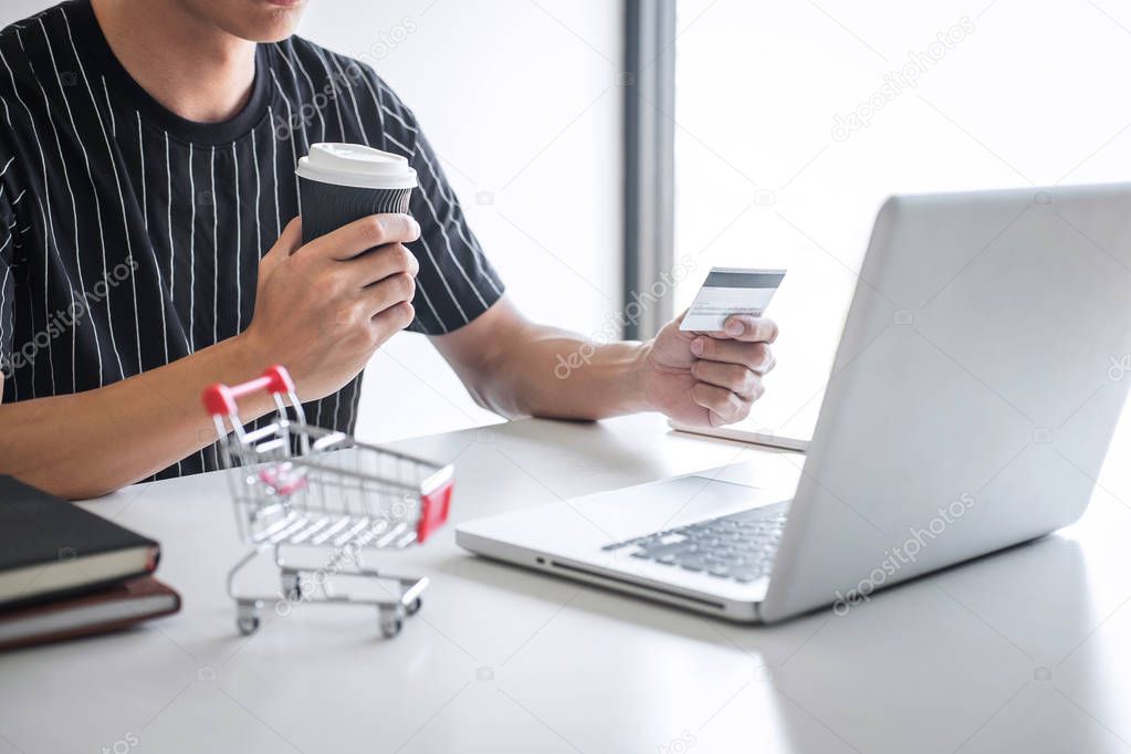 Image of Young man using smartphone for online shopping website 