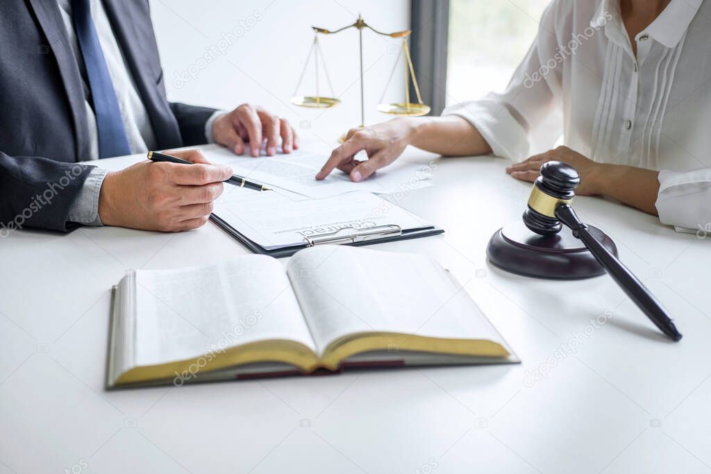 Good service cooperation, Consultation of Businesswoman and Male lawyer or judge counselor having team meeting with client, Law and Legal services concept.