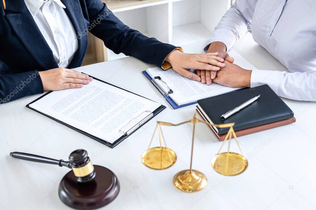Female lawyer or Counselor working in courtroom have meeting with client are consultation with contract papers of real estate, Law and Legal services concept.