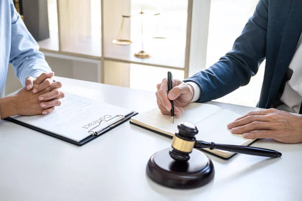 Businesswoman and Male lawyer or judge consult and conference having team meeting with client at law firm in office, Law and Legal services concept.