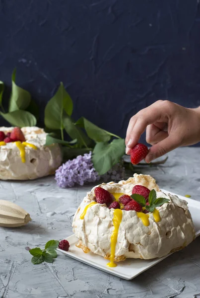 Pavlova cake with strawberry and citrus cake. Strawberry dessert. Cake with berries. Orange curd. Summer cake. Crusty dessert. Meringue.