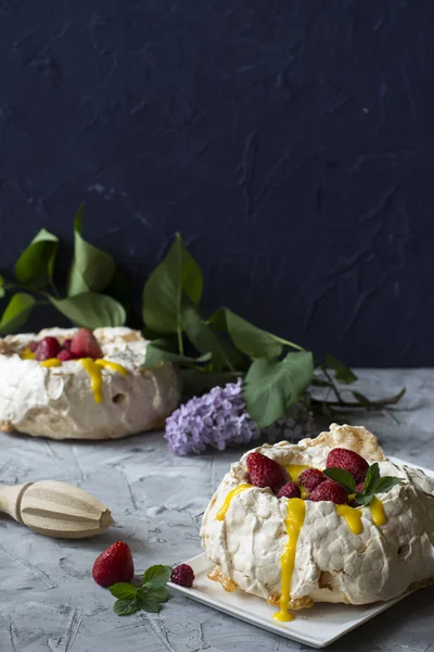 Pavlova cake with strawberry and citrus cake. Strawberry dessert. Cake with berries. Orange curd. Summer cake. Crusty dessert. Meringue.