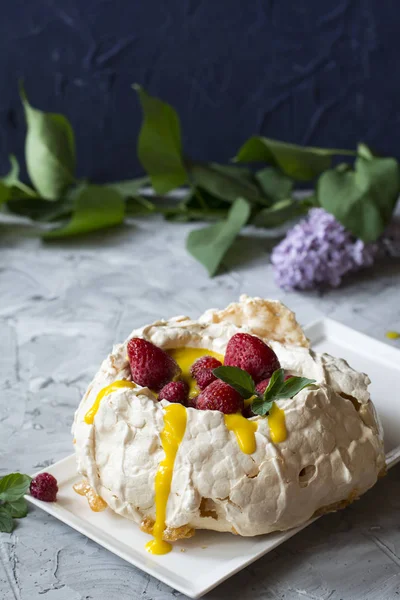 Pavlova cake with strawberry and citrus cake. Strawberry dessert. Cake with berries. Orange curd. Summer cake. Crusty dessert. Meringue.