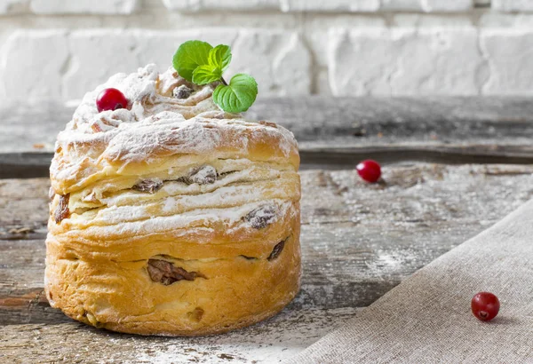 Easter sweet bread Orthodox kulich, paska, willow twigs. Easter Colorful eggs on wooden background. Easter. Holidays breakfast. Easter Palm Sunday. Space for text.