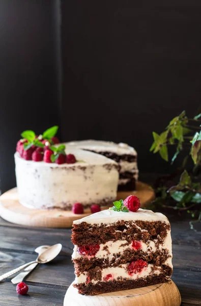 Portion Of Layered Creamy Fruit Cake With In Close Up View Raspberry Cake With Chocolate Chocolate Cake Mint Decoration Cheesecakeon Wooden Table And Dark Background Still Life Of Food Sweet Delicious