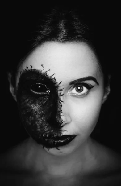 Creepy close-up portrait of a woman with a cursed mark on her face on dark background