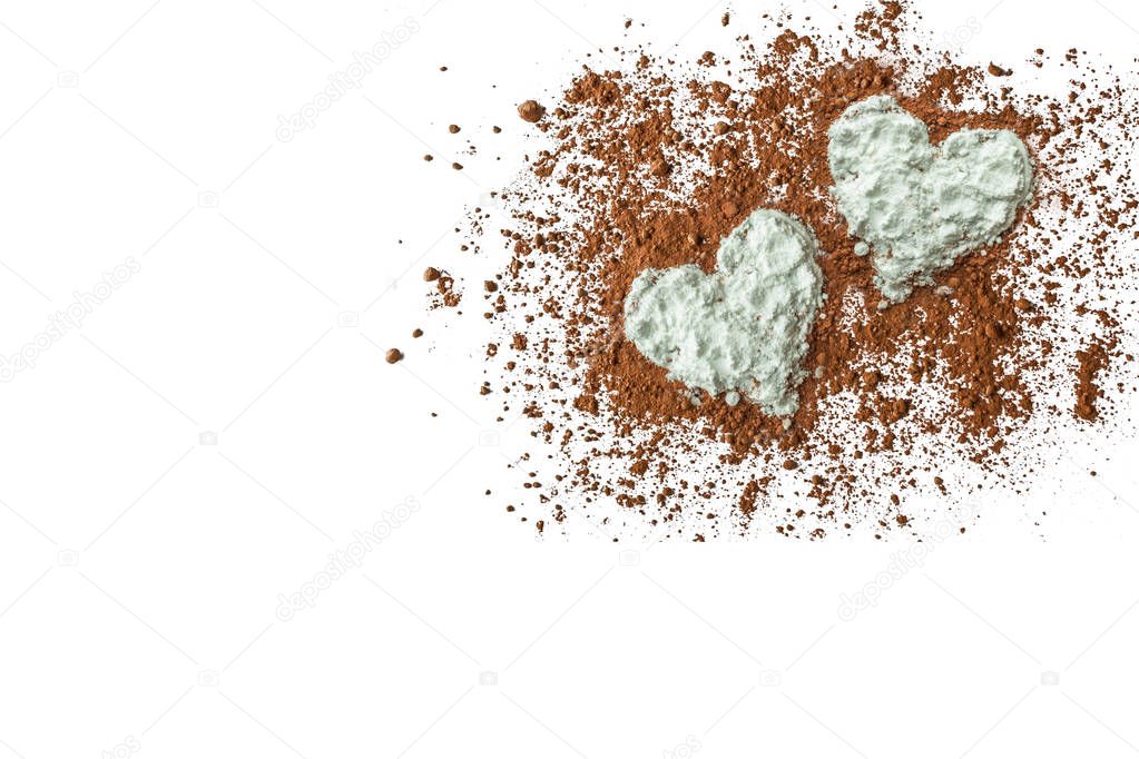 Sugar powder hearts with chocolate powder in the center isolated on the white background top flat view close-up with copy-sapce
