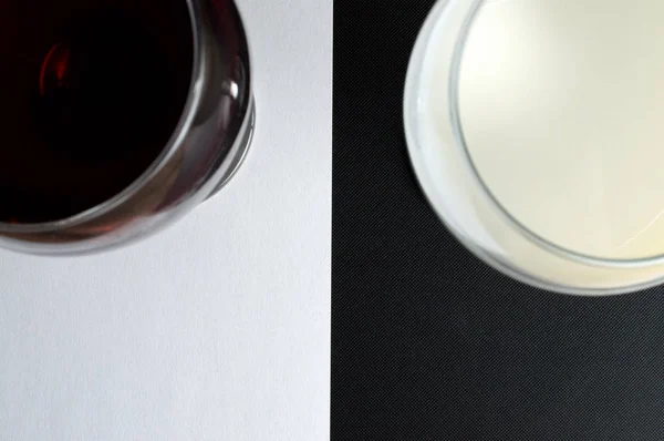 milk and wine on a black white background