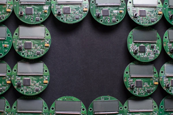 round electronic boards with display, microchip and processor, many meter components