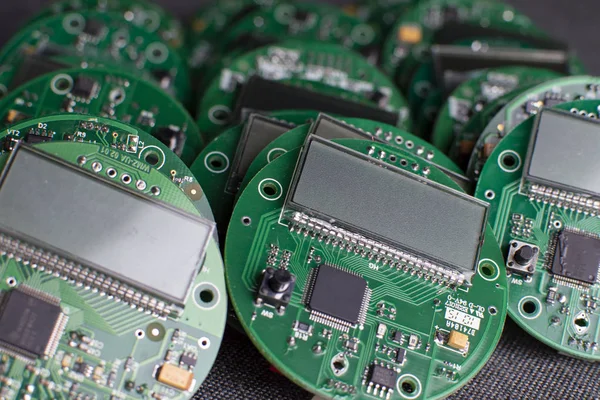 round electronic boards with display, microchip and processor, many meter components