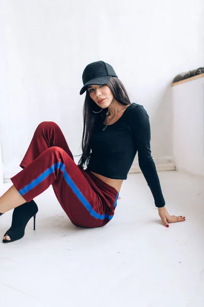 Portrait Brunette Girl Cap Sportswear Natural Light Red Sweatpants Black — Stock Photo, Image