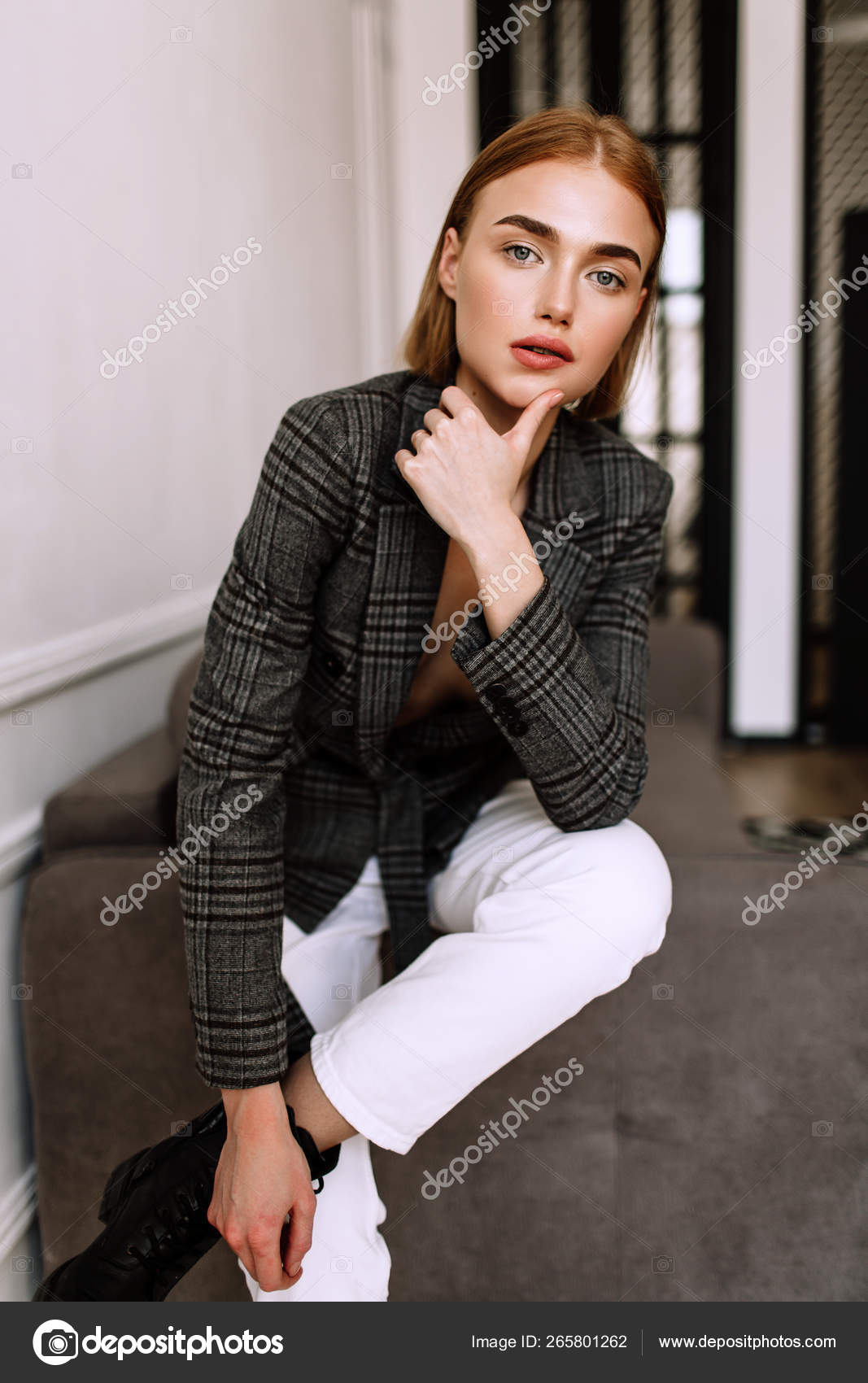 A beautiful sweet girl, dressed on a naked body jacket. Golden stylish