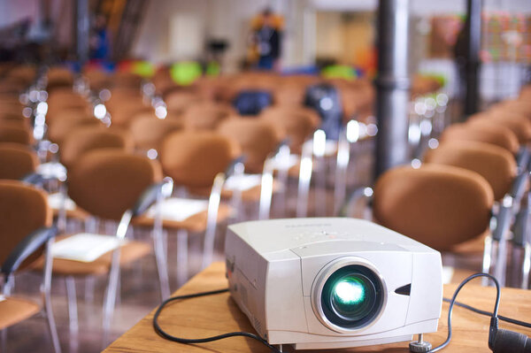 Working projector at the empty conference hall