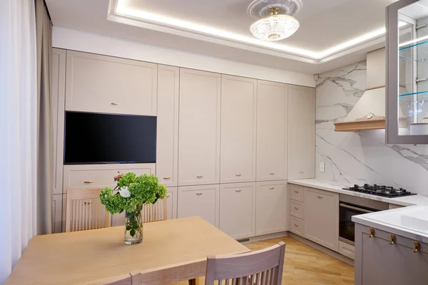 Modern white kitchen clean interior design. Real photo