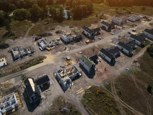New private housing development construction in rural countryside aerial view. Drone photo.