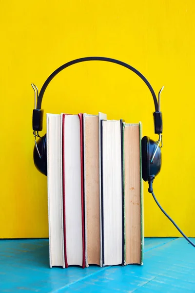 Audio book concept, Books with headphones for listening to audiobook