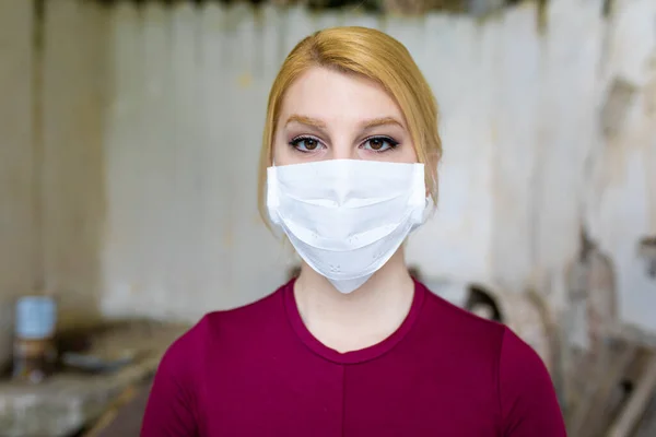 Young woman with face mask protection of Coronavirus.