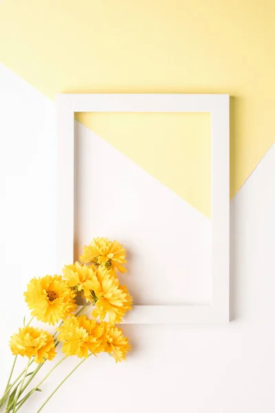 Yellow flowers with frame mockup on white background. Yellow triangle.