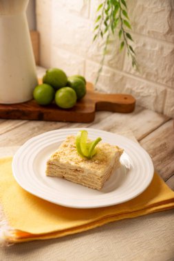 Carlota de Limon, a cold, no-bake dessert made with layers of Maria cookies and a creamy mixture of lemon and condensed milk, an easy homemade recipe very popular in Mexico.