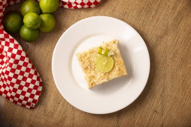 Carlota de Limon, a cold, no-bake dessert made with layers of Maria cookies and a creamy mixture of lemon and condensed milk, an easy homemade recipe very popular in Mexico.