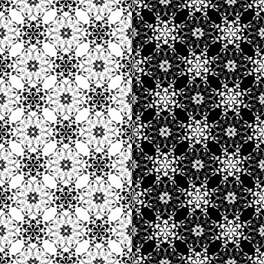 Siyah ve beyaz çiçekli süsler. Tekstil ve duvar kağıtları için sorunsuz arka planlar kümesi