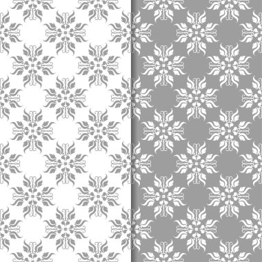 Beyaz ve gri çiçek süsler. Tekstil ve duvar kağıtları için sorunsuz arka planlar kümesi