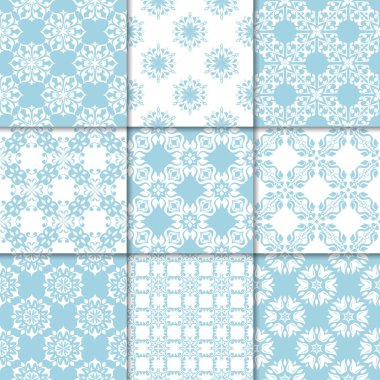 Mavi ve beyaz çiçekli süsler. Kağıt için dikişsiz desen koleksiyonu Tekstil