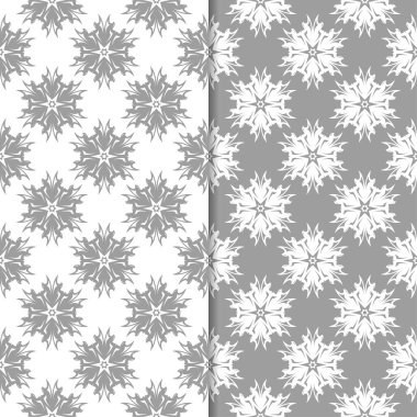 Beyaz ve gri çiçek süsler. Tekstil ve duvar kağıtları için sorunsuz arka planlar kümesi