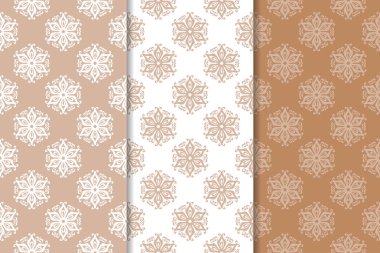 Kahverengi ve bej çiçek arka planlar kümesi. Tekstil ve duvar kağıtları için dikişsiz desen seti