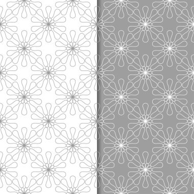Beyaz ve gri çiçek süsler. Tekstil ve duvar kağıtları için sorunsuz arka planlar kümesi
