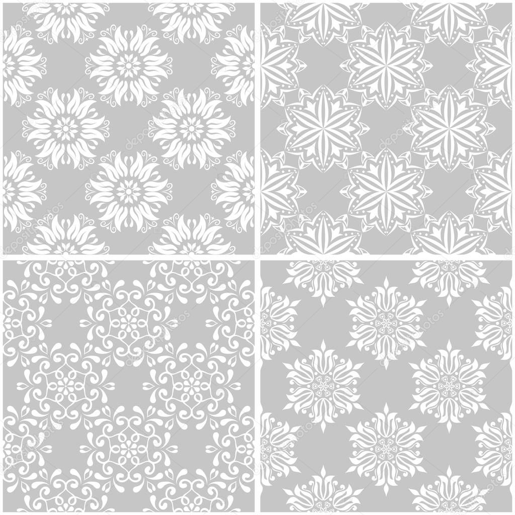 Floral patterns. Set of gray and white monochrome seamless backgrounds. Vector illustration