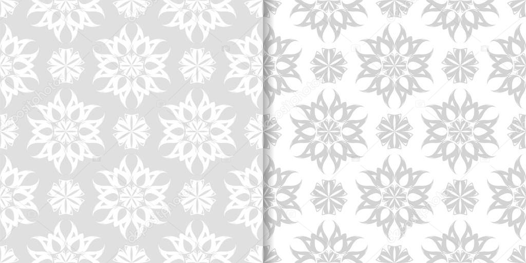 Light gray and white floral ornaments. Set of seamless patterns for textile and wallpapers
