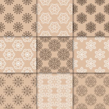 Kahverengi Bej çiçekli süsler. Kağıt için dikişsiz desen koleksiyonu Tekstil