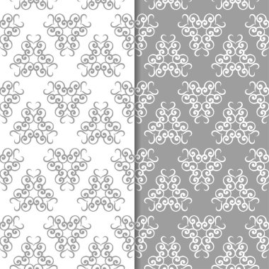 Beyaz ve gri çiçek süsler. Tekstil ve duvar kağıtları için sorunsuz arka planlar kümesi