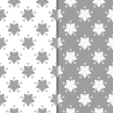 Beyaz ve gri çiçek süsler. Tekstil ve duvar kağıtları için sorunsuz arka planlar kümesi