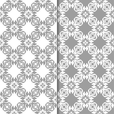 Beyaz ve gri çiçek süsler. Tekstil ve duvar kağıtları için sorunsuz arka planlar kümesi