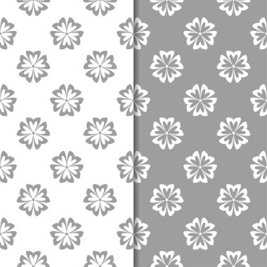 Beyaz ve gri çiçek süsler. Tekstil ve duvar kağıtları için sorunsuz arka planlar kümesi