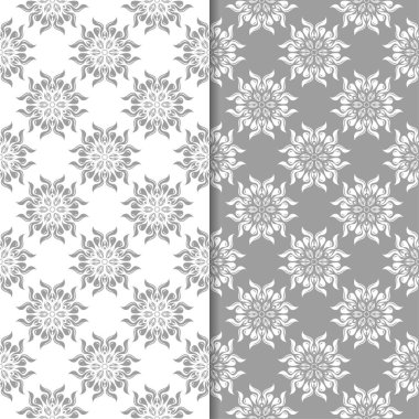 Beyaz ve gri çiçek süsler. Tekstil ve duvar kağıtları için sorunsuz arka planlar kümesi